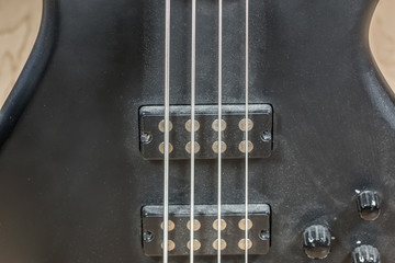 Black bass guitar with a lot of dust © Hacki Hackisan