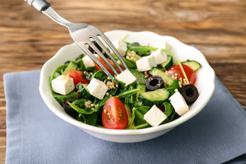 Eating of healthy fresh salad, closeup