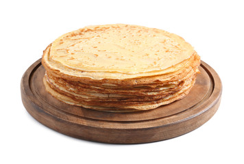 Board with tasty thin pancakes on white background