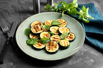 Tasty grilled zucchini on plate