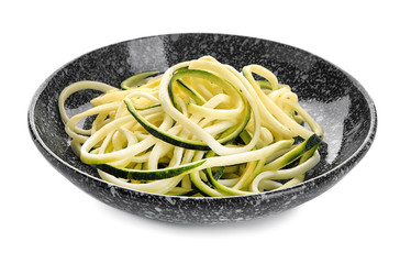 Plate with zucchini spaghetti isolated on white