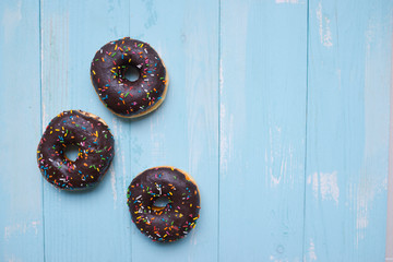 Baked chocolate doughnuts with chocolate glaze. toning. selective focus