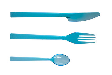 Plastic cutlery: knife, fork and spoon on a white background.
