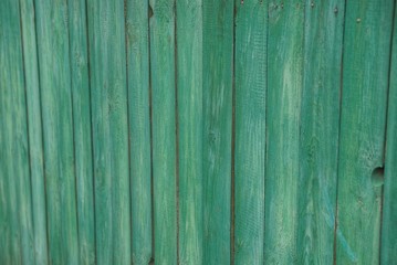 Fototapeta na wymiar green wooden texture of old boards in a fence