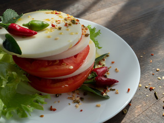 Beautiful and tasty food on a plate, dark wooden background