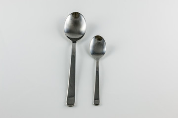 Steel cutlery with table spoon and little spoon