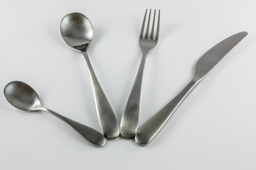 Cutlery with knife, fork, table spoon and little spoon
