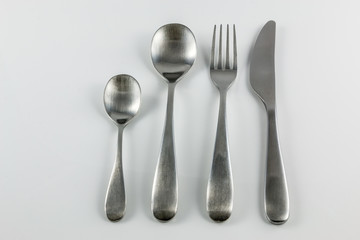 Cutlery with knife, fork, table spoon and little spoon