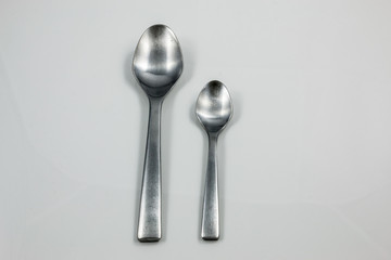 Steel cutlery with table spoon and little spoon