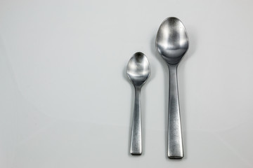 Steel cutlery with table spoon and little spoon