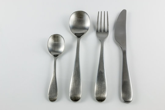 Cutlery with knife, fork, table spoon and little spoon
