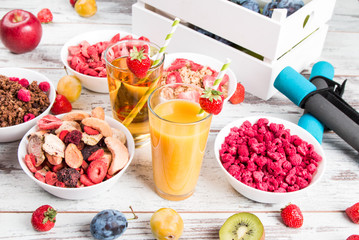Breakfast served with healthy cereals, orange and apple juice, fruits. Balanced diet.