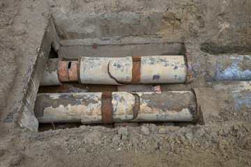 Excavation pit. Old drink water pipe.