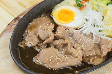 sliced pork steak on hot plate - Asian style	