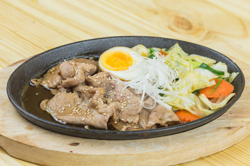 sliced pork steak on hot plate - Asian style	