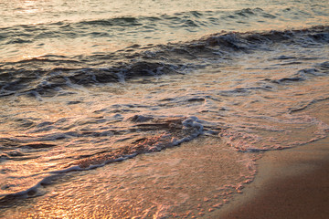 sea wave at sunset