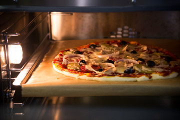 Pizza in a metal oven