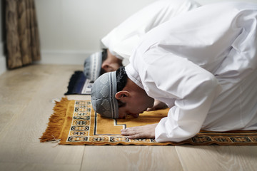 Muslim prayers in Sujud posture - obrazy, fototapety, plakaty