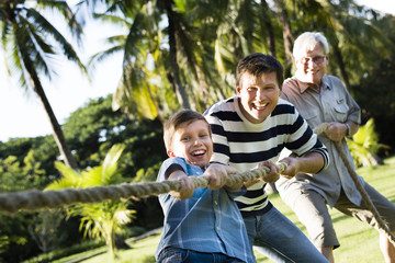 Family playing tug of war