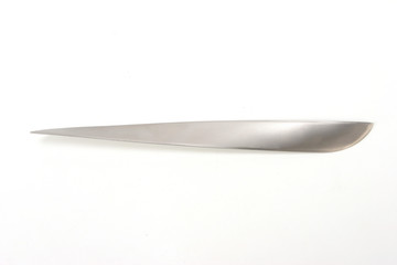 A metallic paper knife isolated on a white background