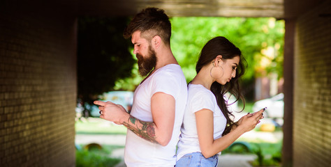 Girl attractive brunette bearded hipster man stand back to back porch underground crossing....