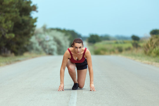 New Start Fitness With New Year Resolution Runner Woman Getting Ready To Run For Weight Loss - Setting Goals And Targets Tomaintain A Healthy Life.