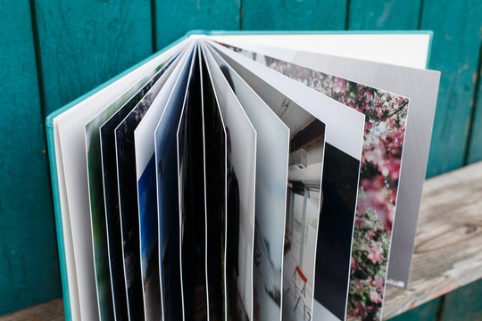 photobook with leather cover.
Photo book on a bright background.
wedding album.
Photo album on a wooden surface.
photobook pages
Expanded photo album.