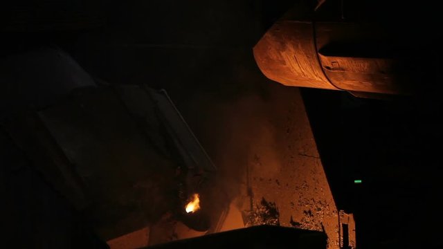 Melting of metal in a steel plant. Factory for the manufacture of metal pipes