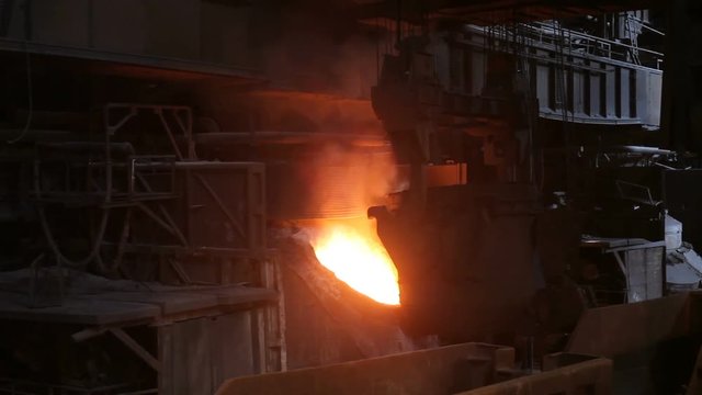 Melting of metal in a steel plant. Factory for the manufacture of metal pipes