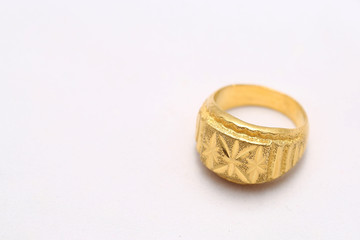 Beautiful gold ring on white background