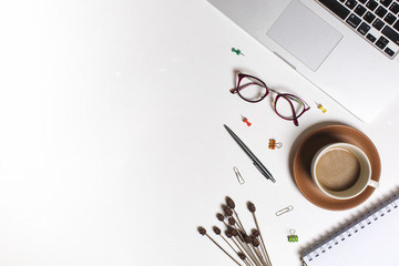 Flat lay workspace picture, cup of coffee, notebook and pen on white background. Business workplace concept. Work desktop with coffee, enjoy working.