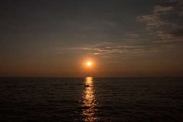 Obraz premium Sunset with strong rays at the coast of Croatia. Concept. Tourism.
