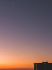 minimalistic skyscraper big sky space, sunrise moon
