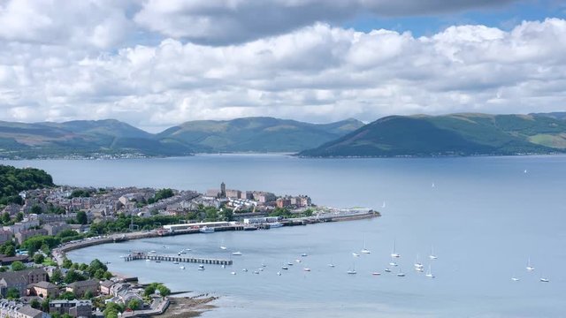 View of Gourock Harbour from Lyle Hill in Greenock during the summer showing boats and ferry time-lapse