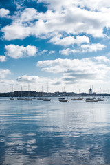 Boston Harbor Sea with boats and skyline clouds background blue daylight port ocean lake river...