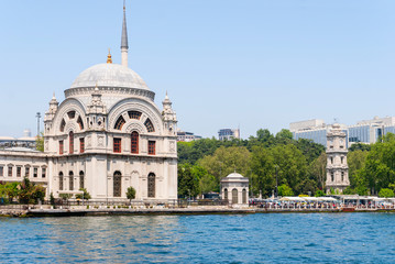 Fototapeta na wymiar Dolmabahce Mosque. Famous historical structure of Istanbul and a view from the sea.
