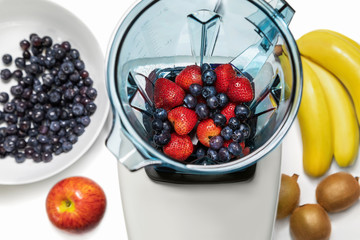 Series of shots. Photo 6. Strawberries and blueberries in a blender.