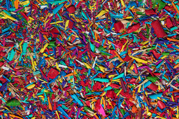 Colourful graphite pencils and shavings background. Back to school background. Macro photography.