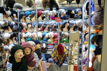 A lot of mannequin's heads in colourful hats