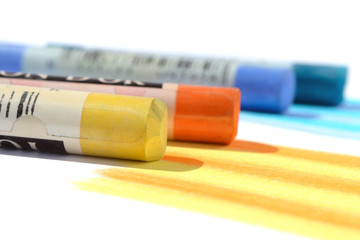 Several dry pastels on a white background selective focus