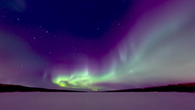 spectacular aurora over frozen lake