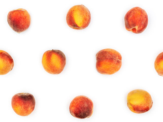 Background of ripe peaches on white.
