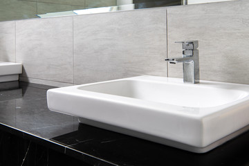 Fototapeta premium Bathroom interior with sink and faucet