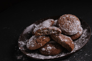 oatmeal cookies on a black table in castor sugar