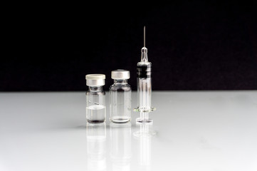 Syringe and vials closeup with selective focus and crop fragment. Medical and Healthcare Concept