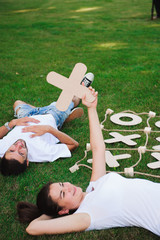 Friends rest and play tic-tac-toe