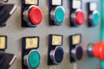 The control panel of the machine with buttons and switches.