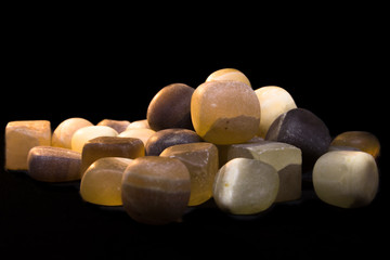Small agate stones on a black background