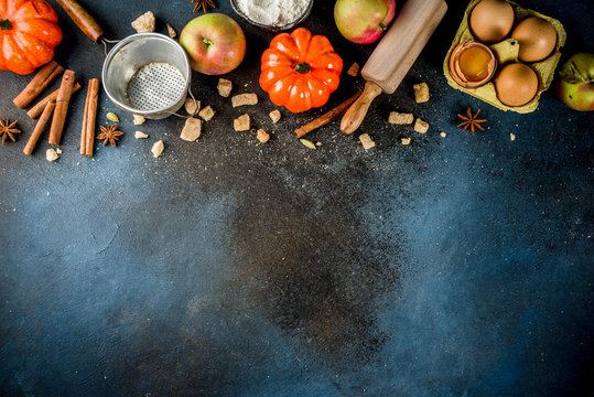 Sweet Autumn Baking Concept, Cooking Background With Baking Accessories, Flour, Rolling Pin, Decorative Pumpkins, Apples, Cinnamon Spices With Anise Cardamom Sugar. 