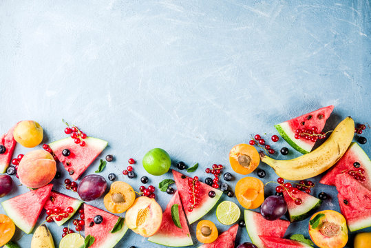 Summer Vitamin Food Concept, Various Fruit And Berries Watermelon Peach Mint Plum Apricots Blueberry Currant, Creative Flat Lay On Light Blue Background Top View Copy Space